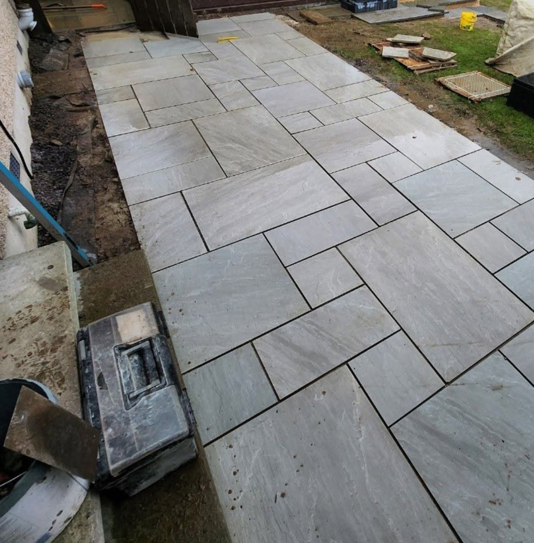 Indian sandstone patio in a random-bond layout